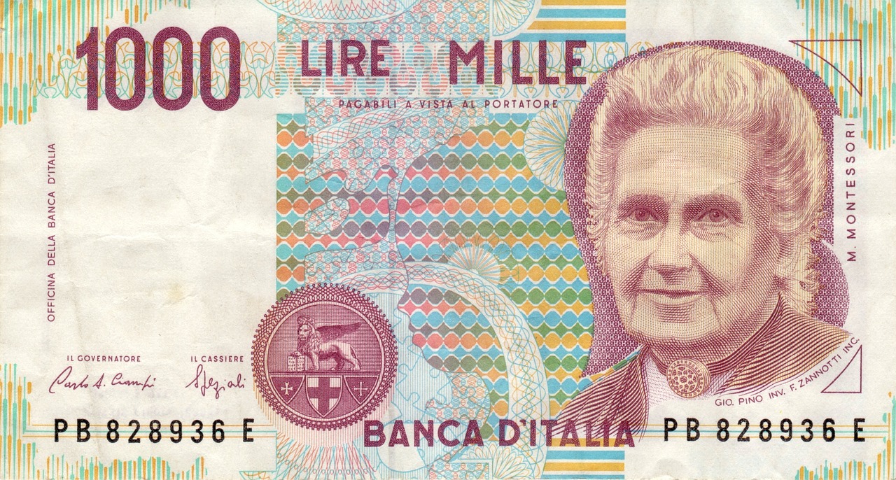 Banconota da 500.000 Lire di Raffaello su sfondo bianco, simbolo di valore collezionistico.